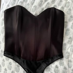Black corset-like body suit. Super sexy, brand new with tags, satin, size 10